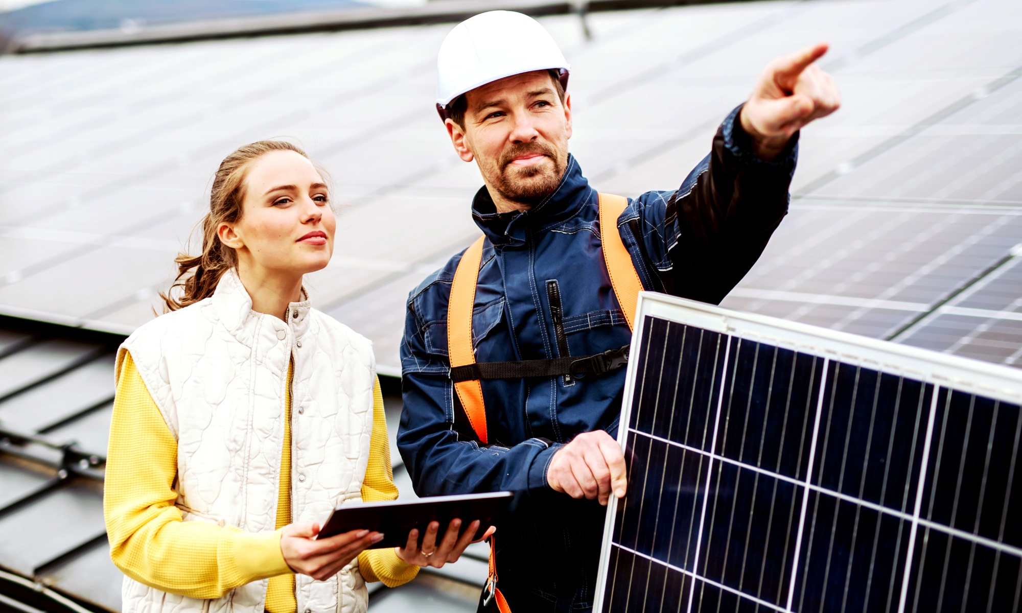 Man and woman with solar panels